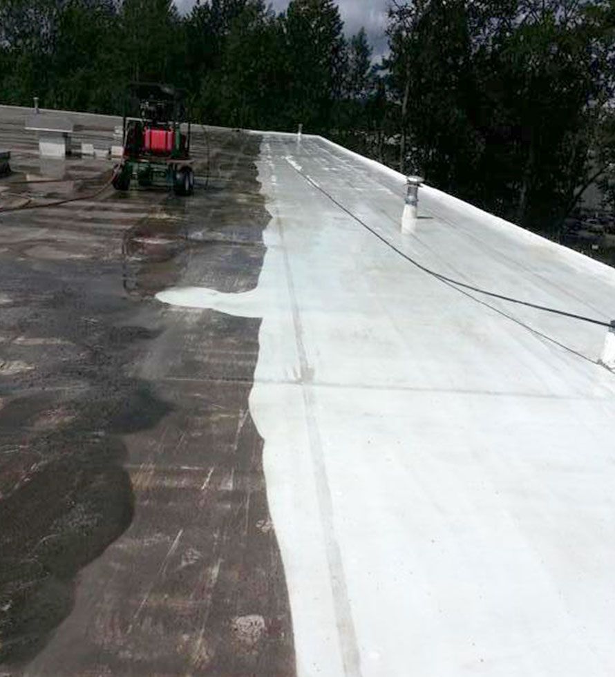 A commercial roof in the progress of being deep cleaned.