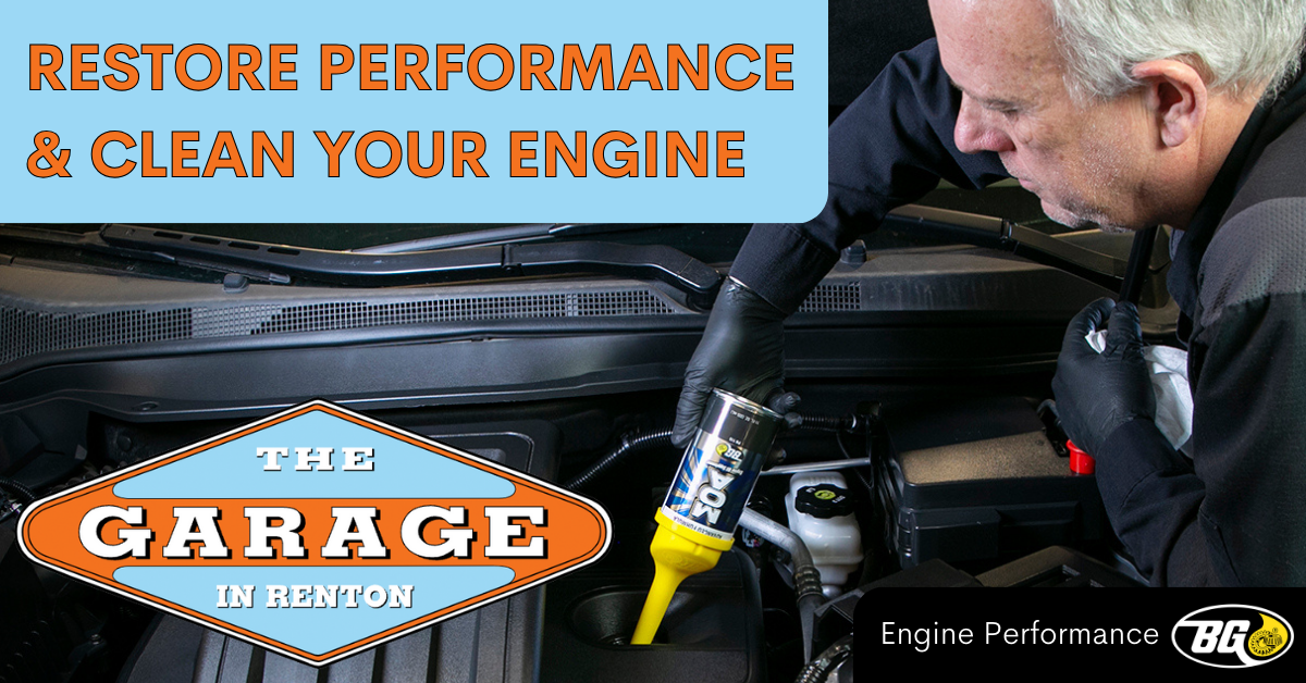 An advertisement for the garage in benton shows a man working on an engine | The Garage in Renton