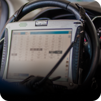 A tablet is sitting on the steering wheel of a car | The Garage in Renton