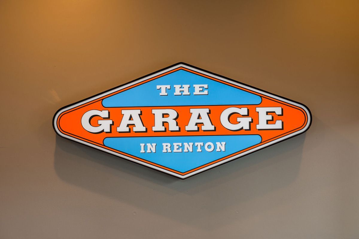 A sign that says the garage in renton on it | The Garage in Renton