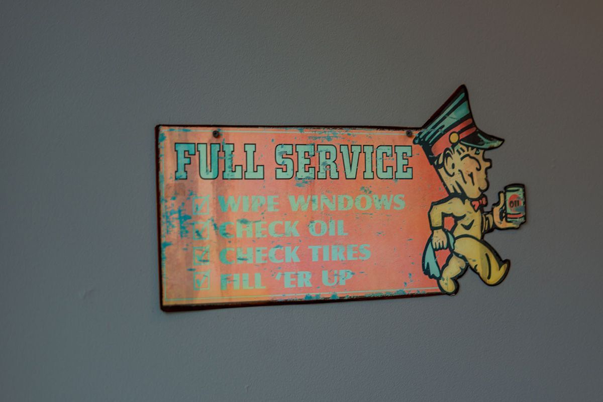 A sign that says full service on it | The Garage in Renton