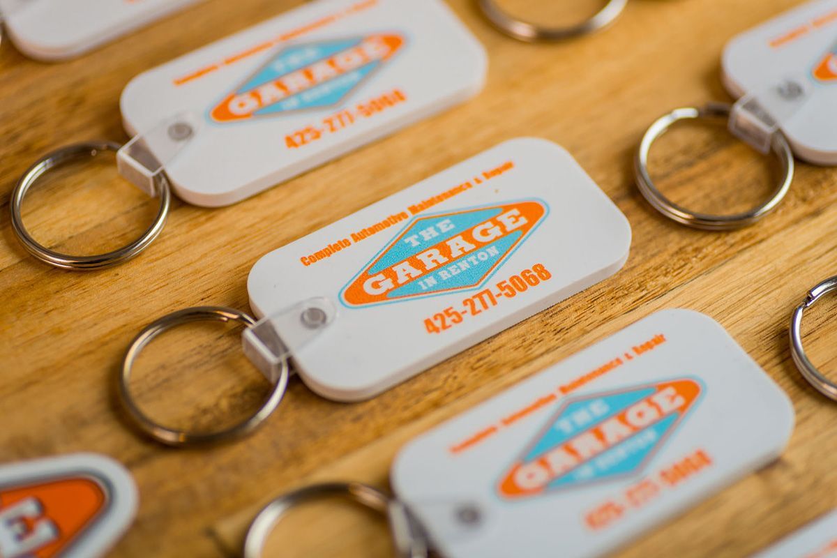 A bunch of keychains with the word garage on them | The Garage in Renton