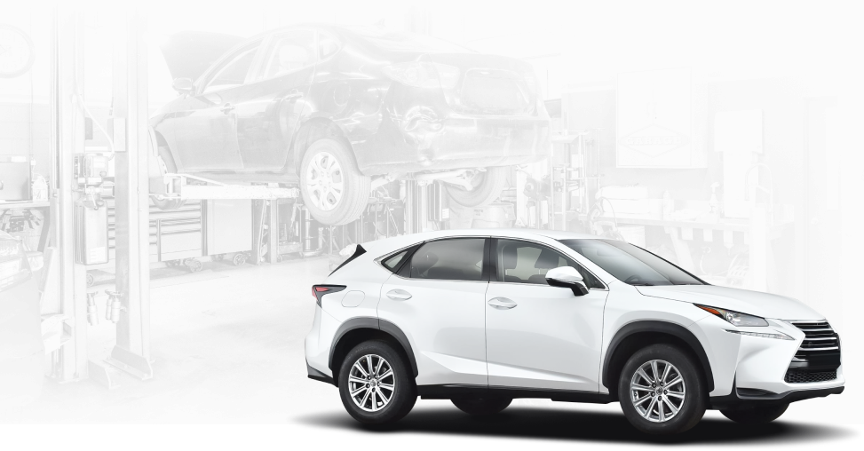 A white lexus nx is parked in a garage. | The Garage in Renton