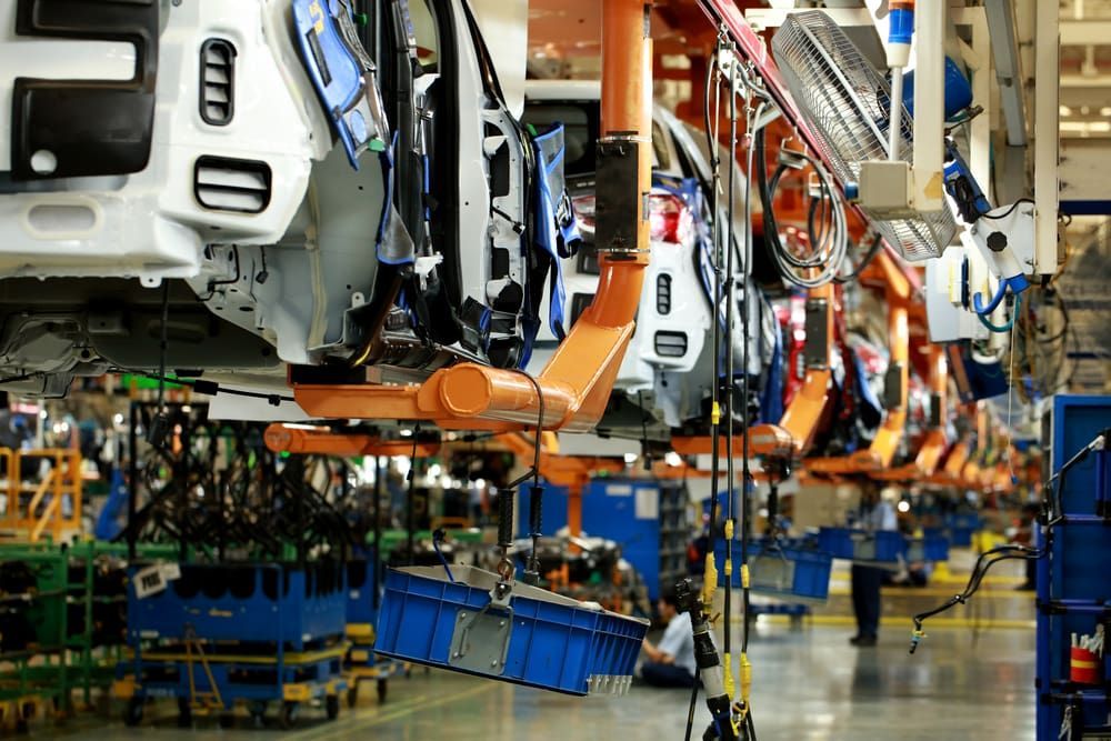 A Row of Cars Are Being Assembled in a Factory — Aurablue Electric in Maitland, NSW
