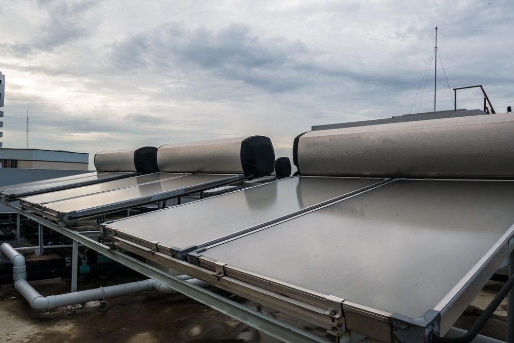 A Row of Solar Panels on the Roof of a Building — Aurablue Electric in Fullerton Cove, NSW