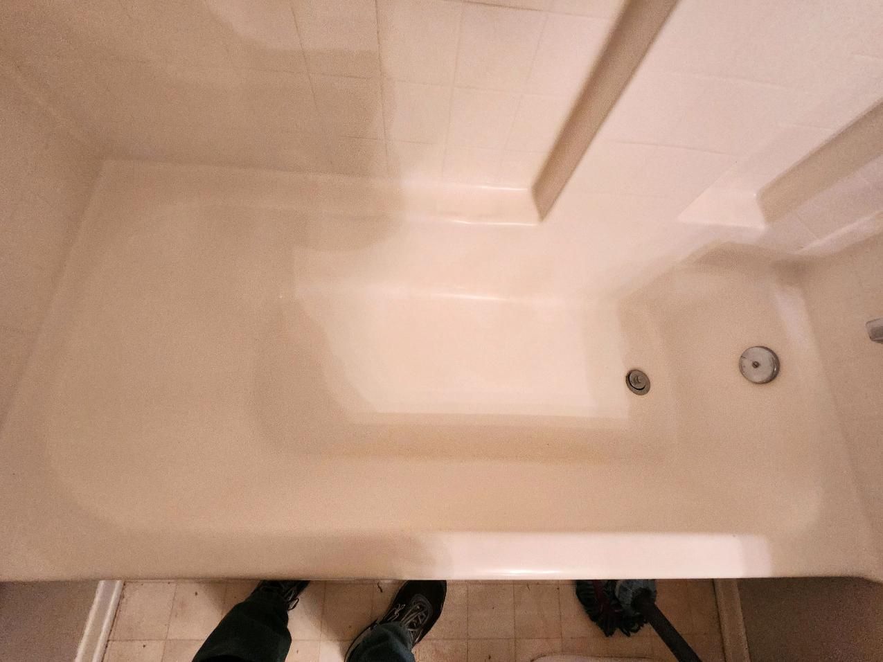 Beige bathtub viewed from above.