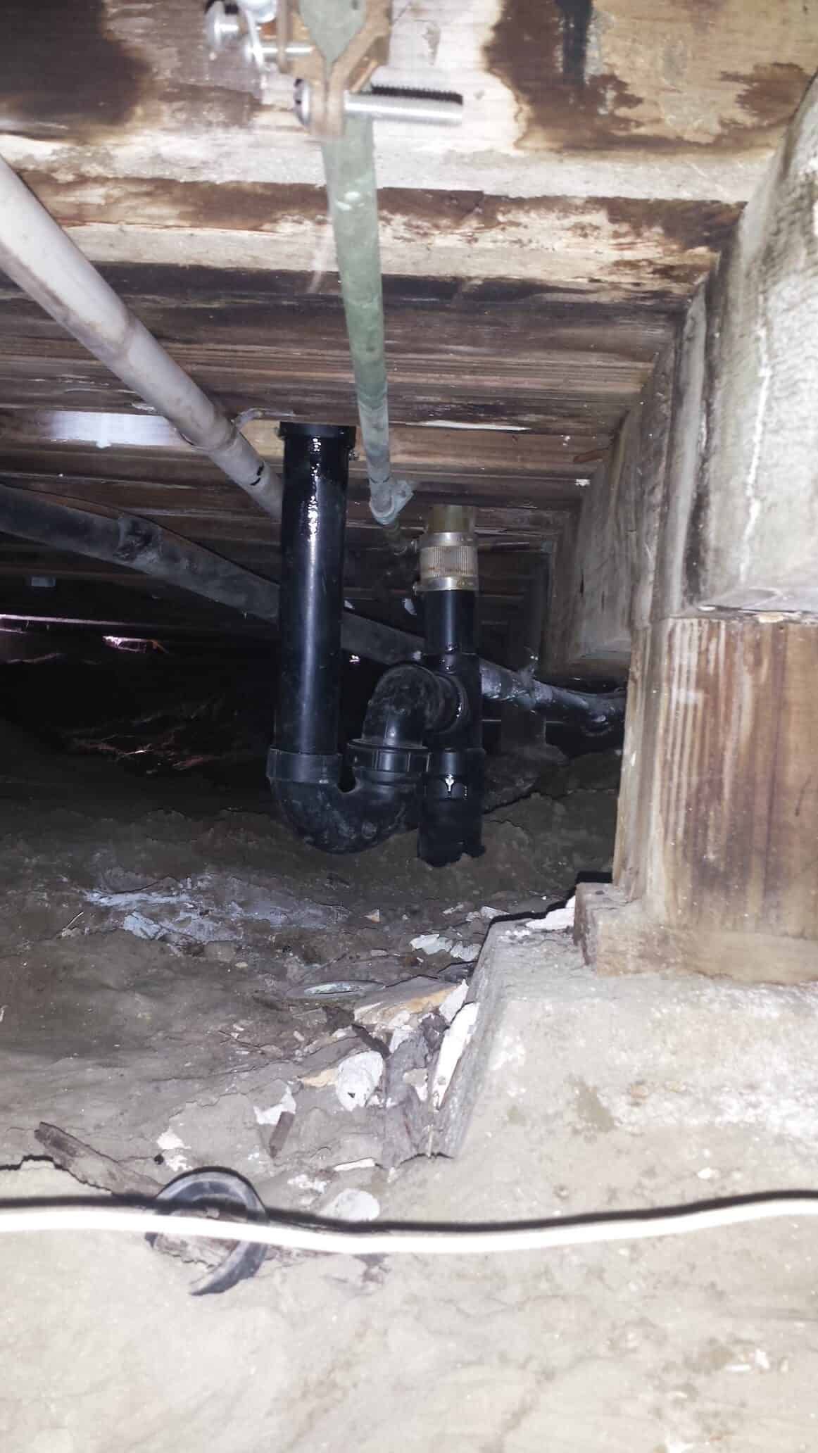 A Drain Pipe In The Corner Of A Basement — Anaheim, CA — Accurate Plumbing and Drains