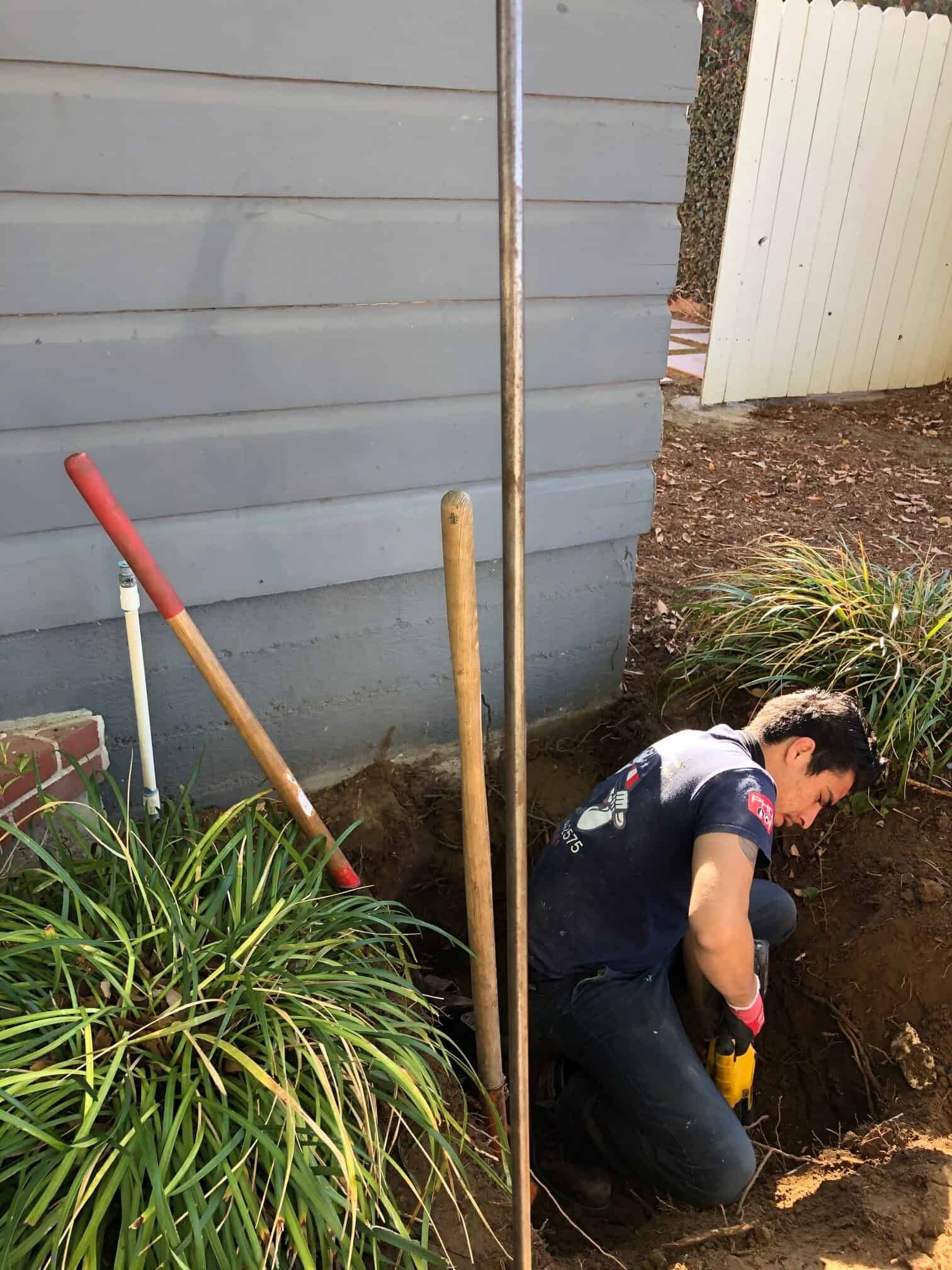A Man Installing A Drain — Anaheim, CA — Accurate Plumbing and Drains