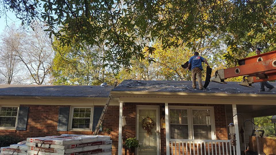 ROOF REPLACEMENT, workers on roof