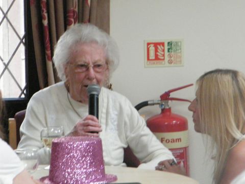 a carer having a conversation with an elderly lady