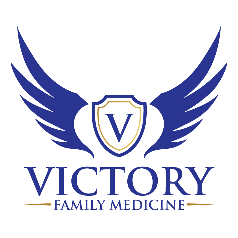 A logo for victory family medicine with a shield and wings