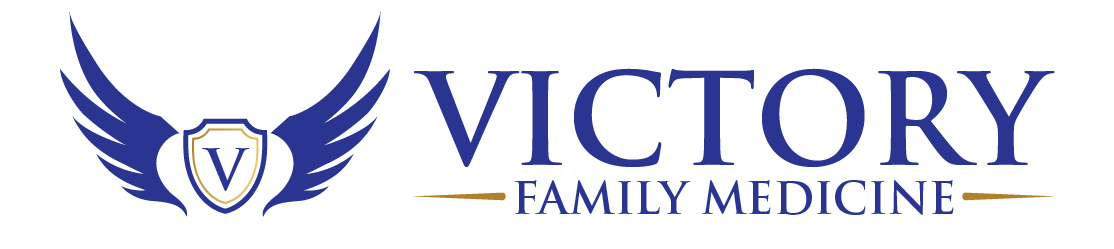 A logo for victory family medicine with a shield and wings.