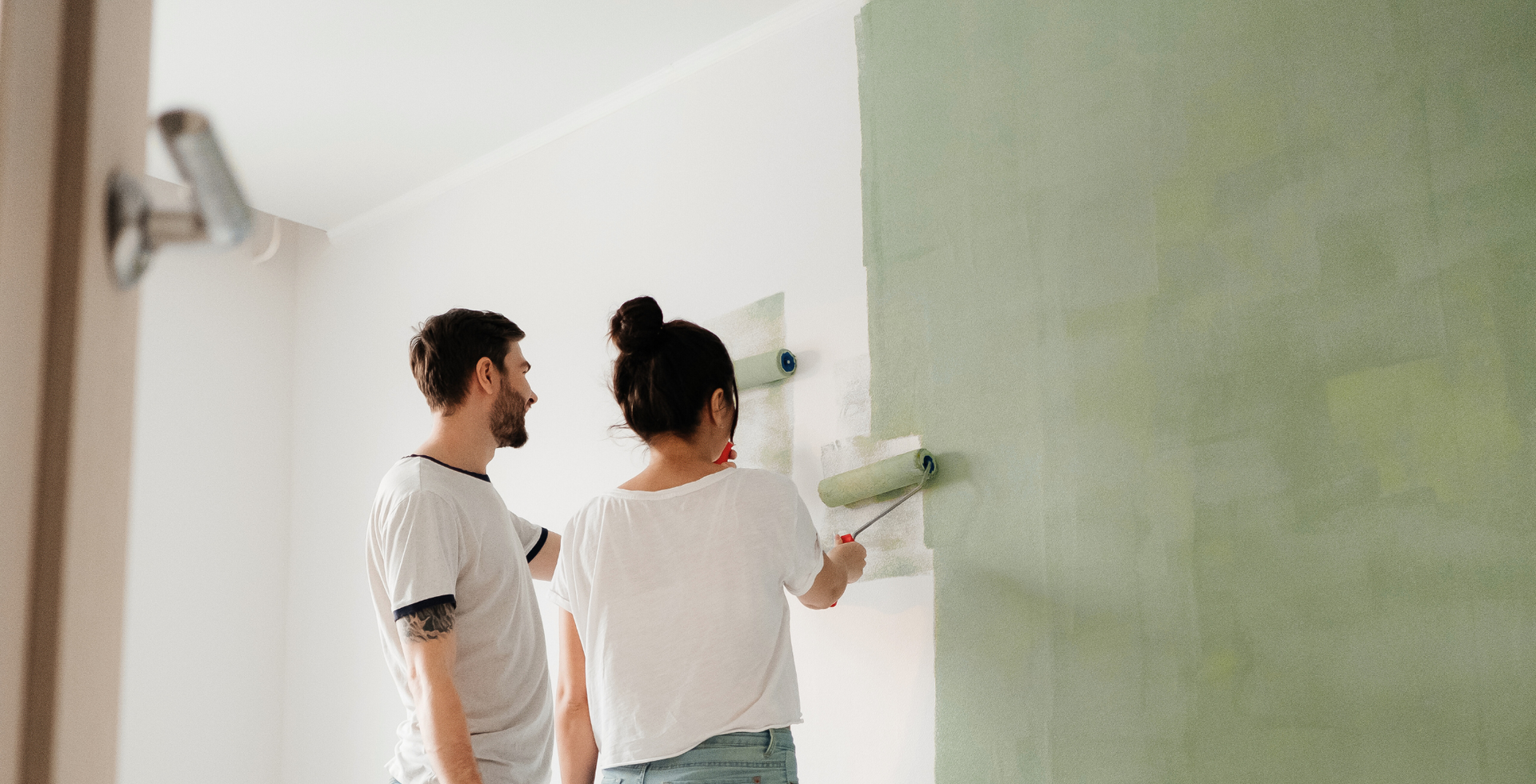 man and woman painting together