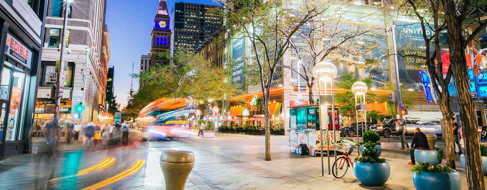 A blurry picture of a city street at night.