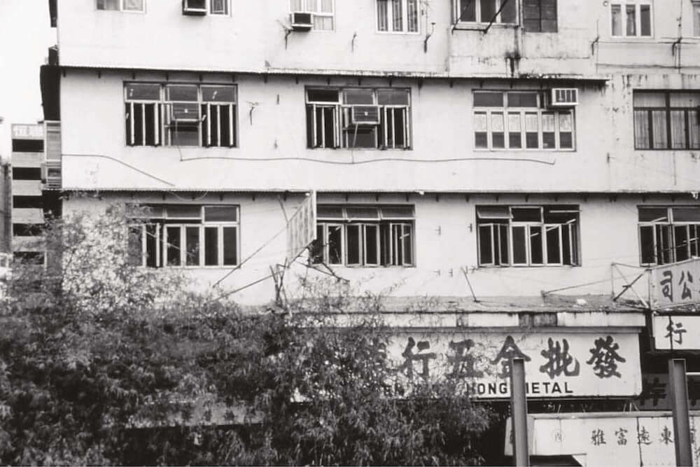 A black and white photo of a building with chinese writing on it