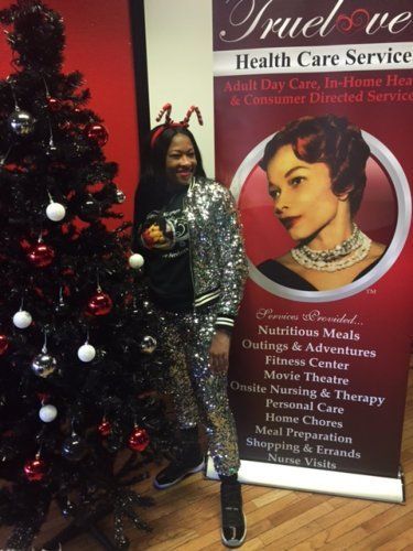 Woman Taking A Picture On Christmas Tree — Nashville TN — Trueloves Health Care Services