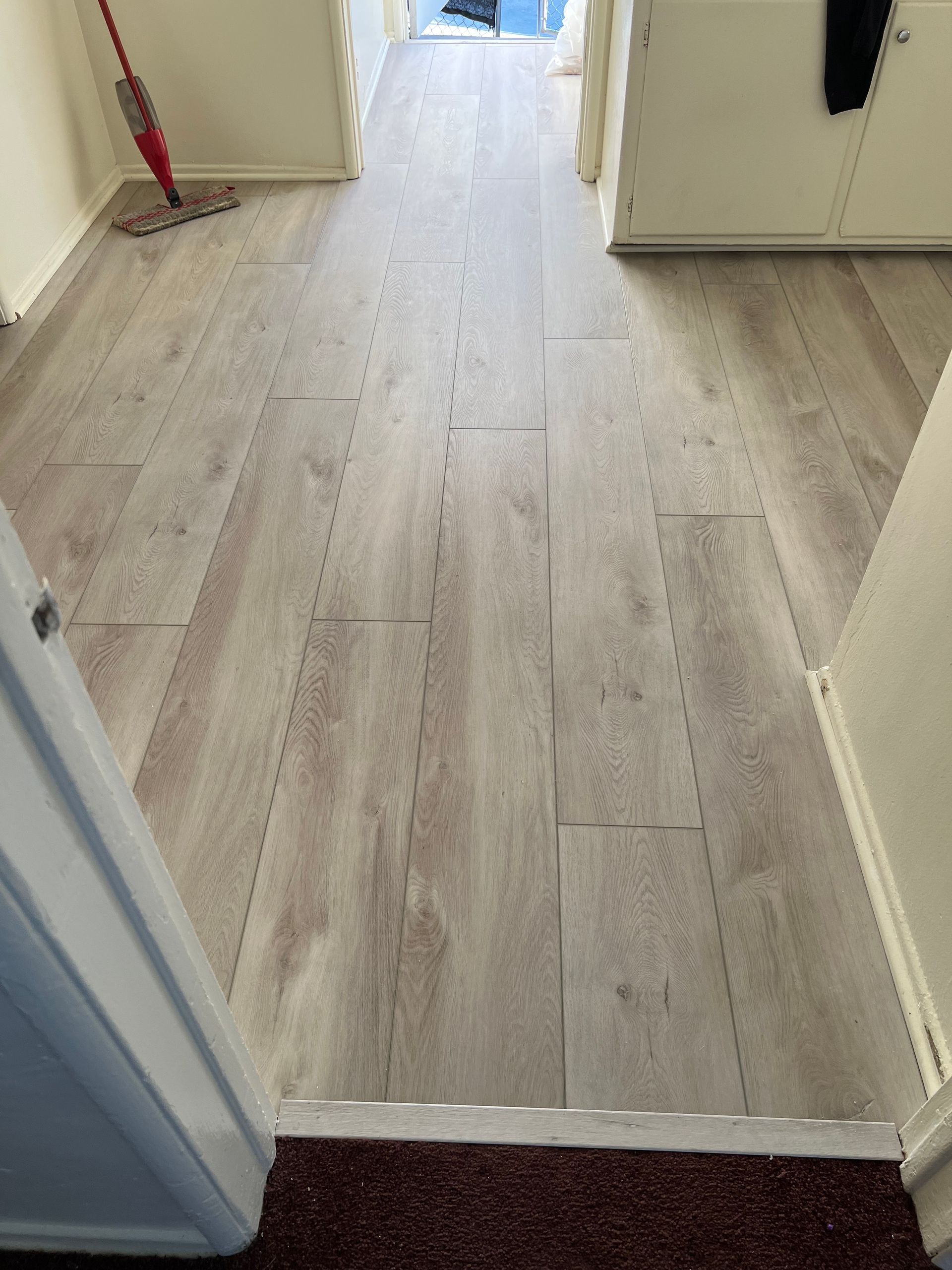 A wooden floor with light brown color.