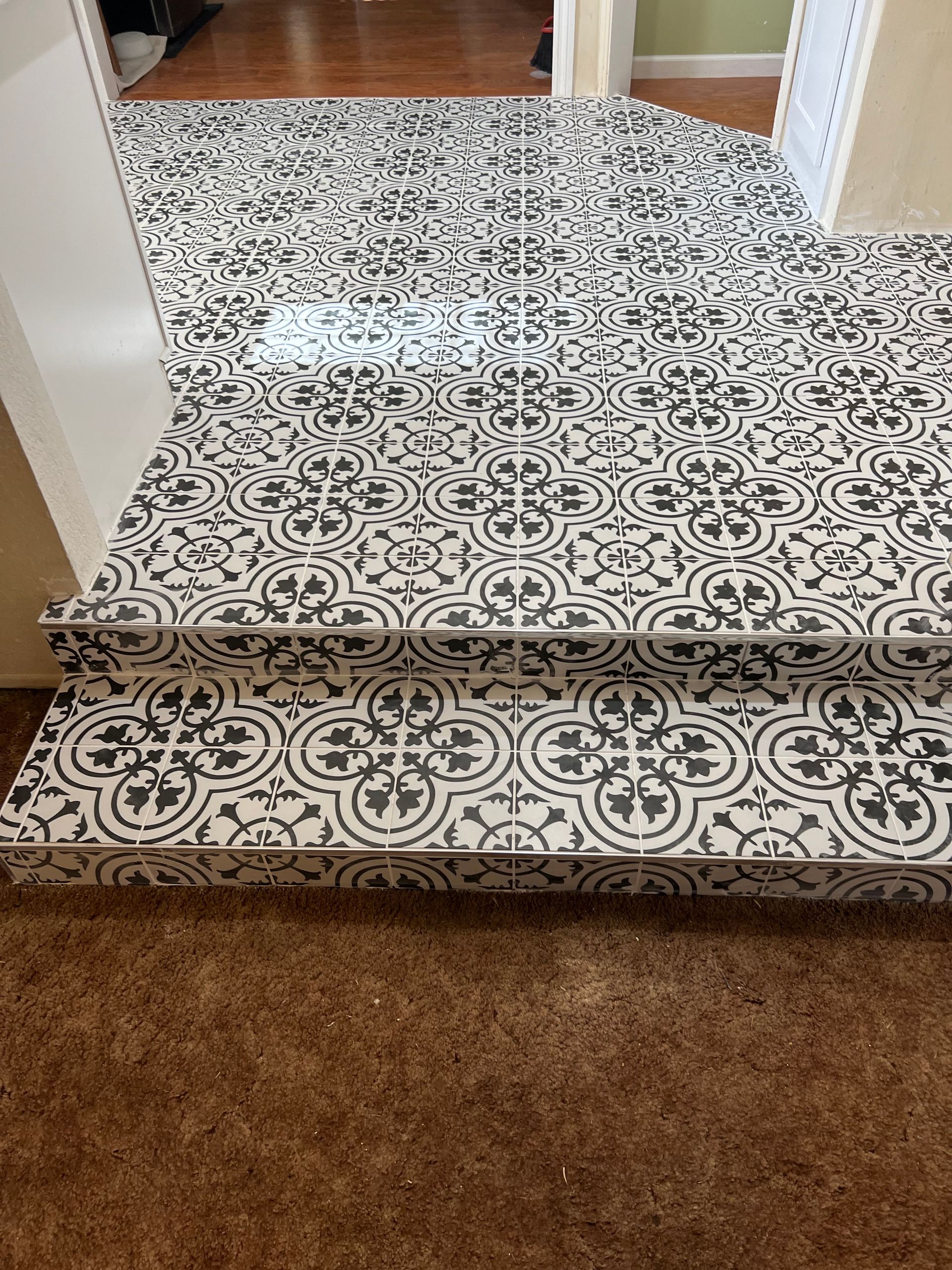 White floor with designs in black.