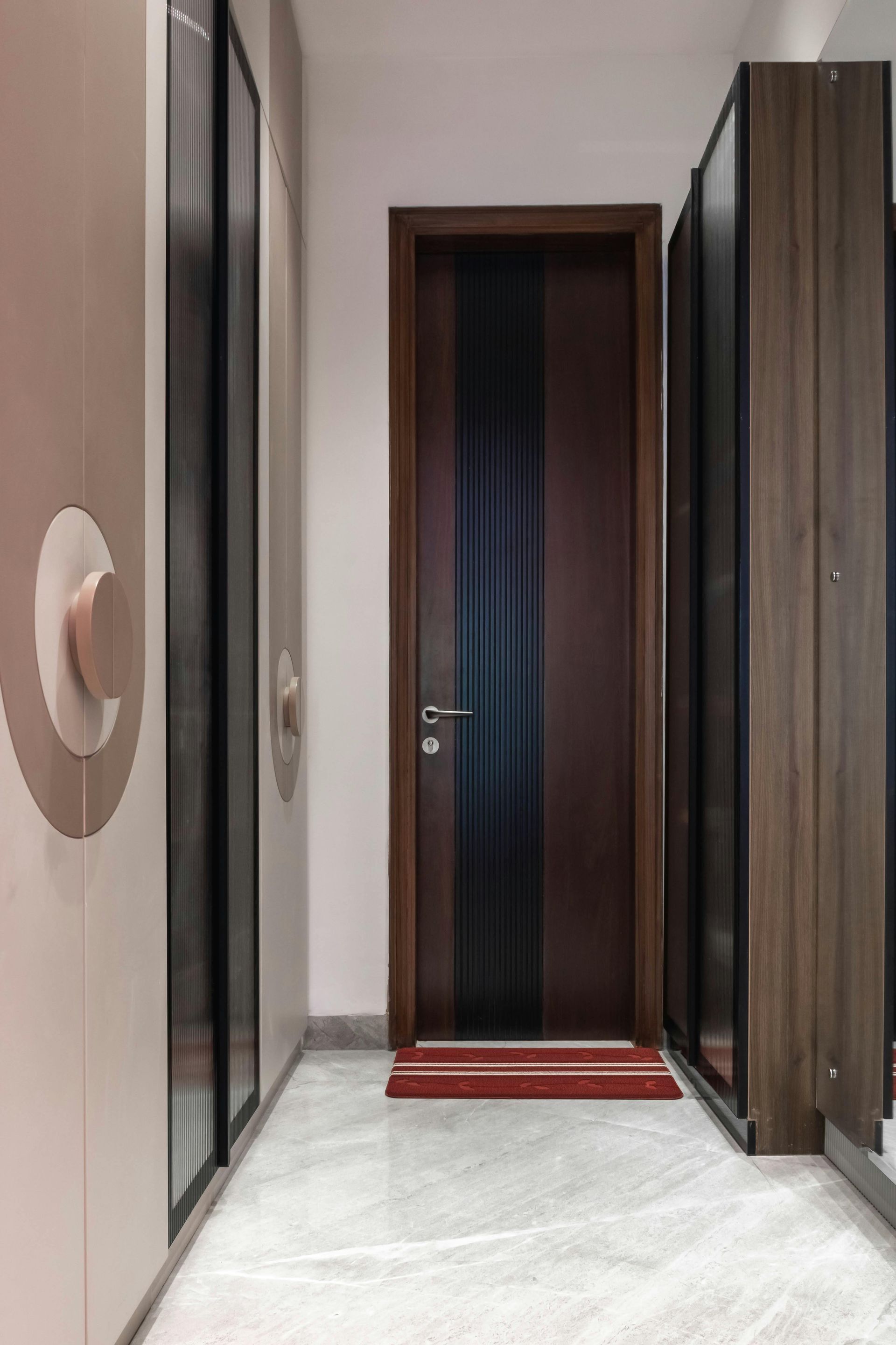 There is a door in the middle of the hallway.