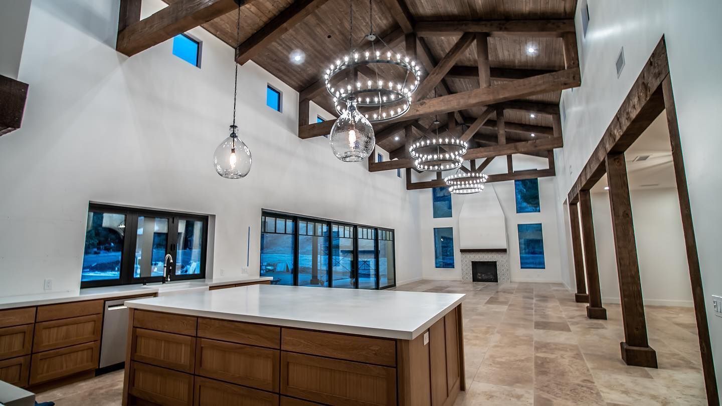A kitchen with a large island in the middle of the room.