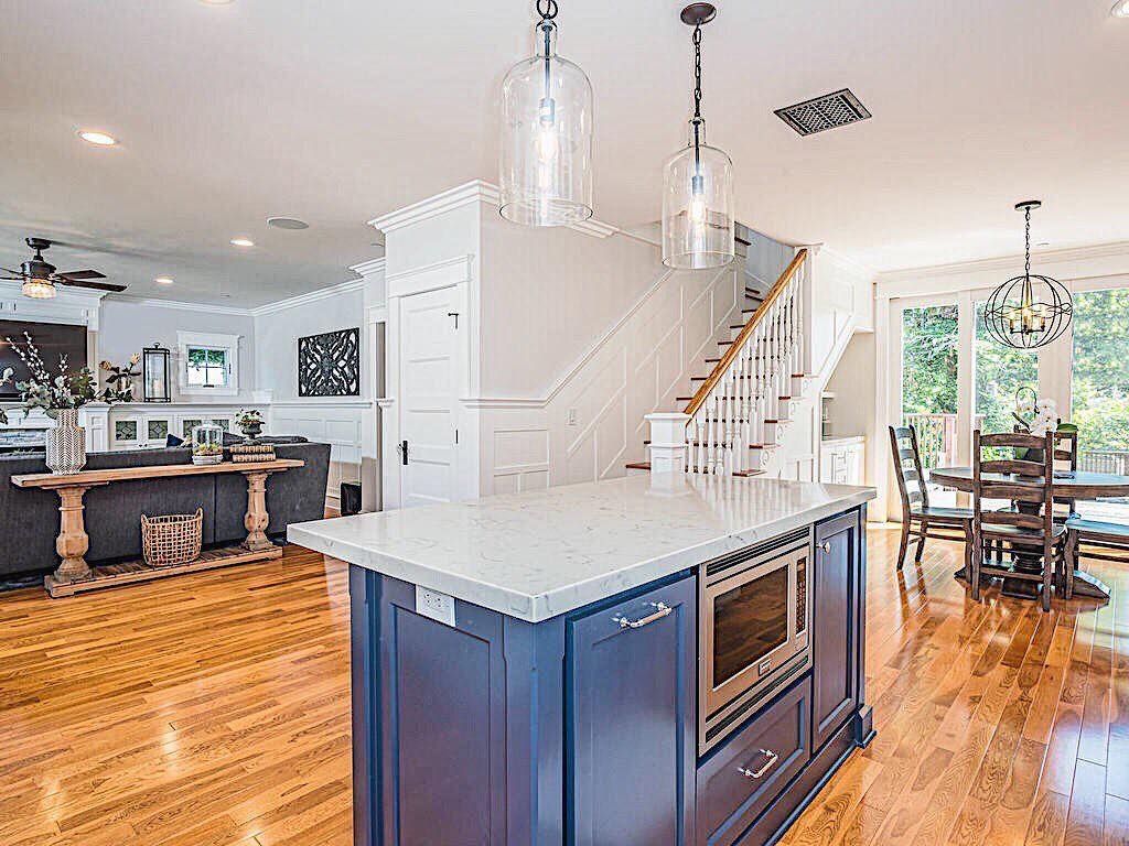A kitchen with a large island in the middle of the room.