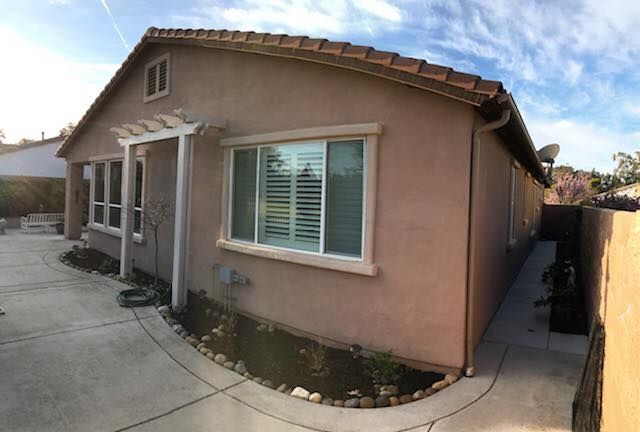 A house with a lot of windows and shutters