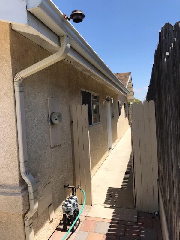 A hose is attached to the side of a house