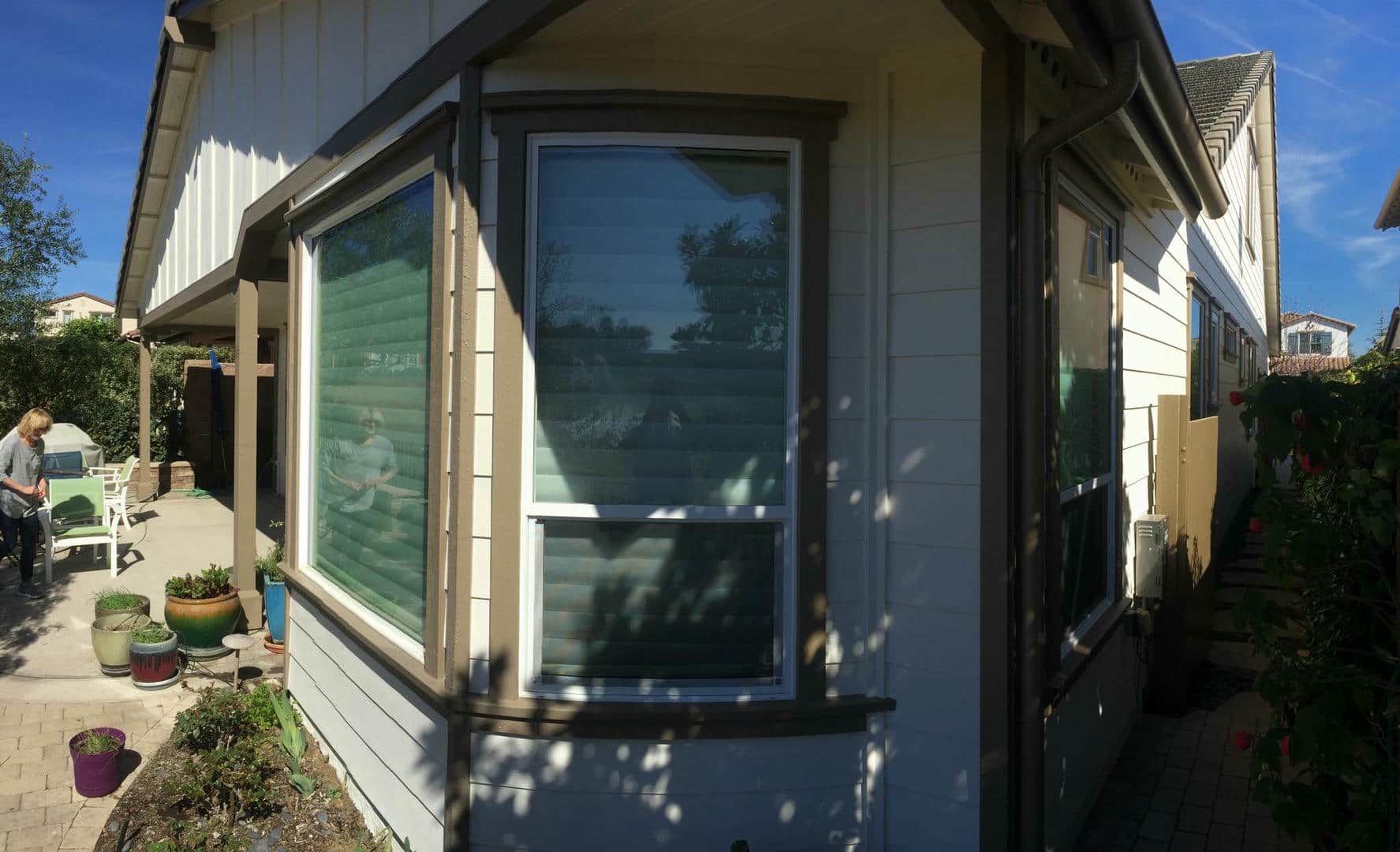 A house with a large window on the side of it