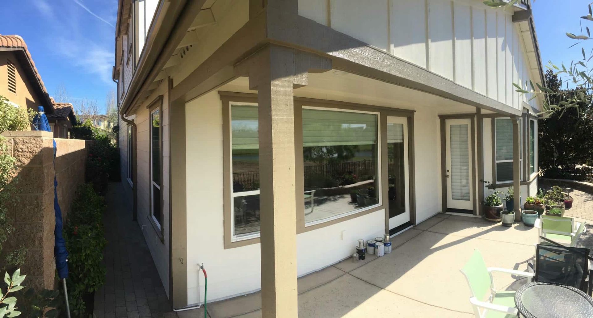 A house with a patio and a lot of windows