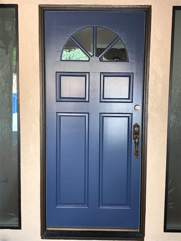 A blue door with a window on it
