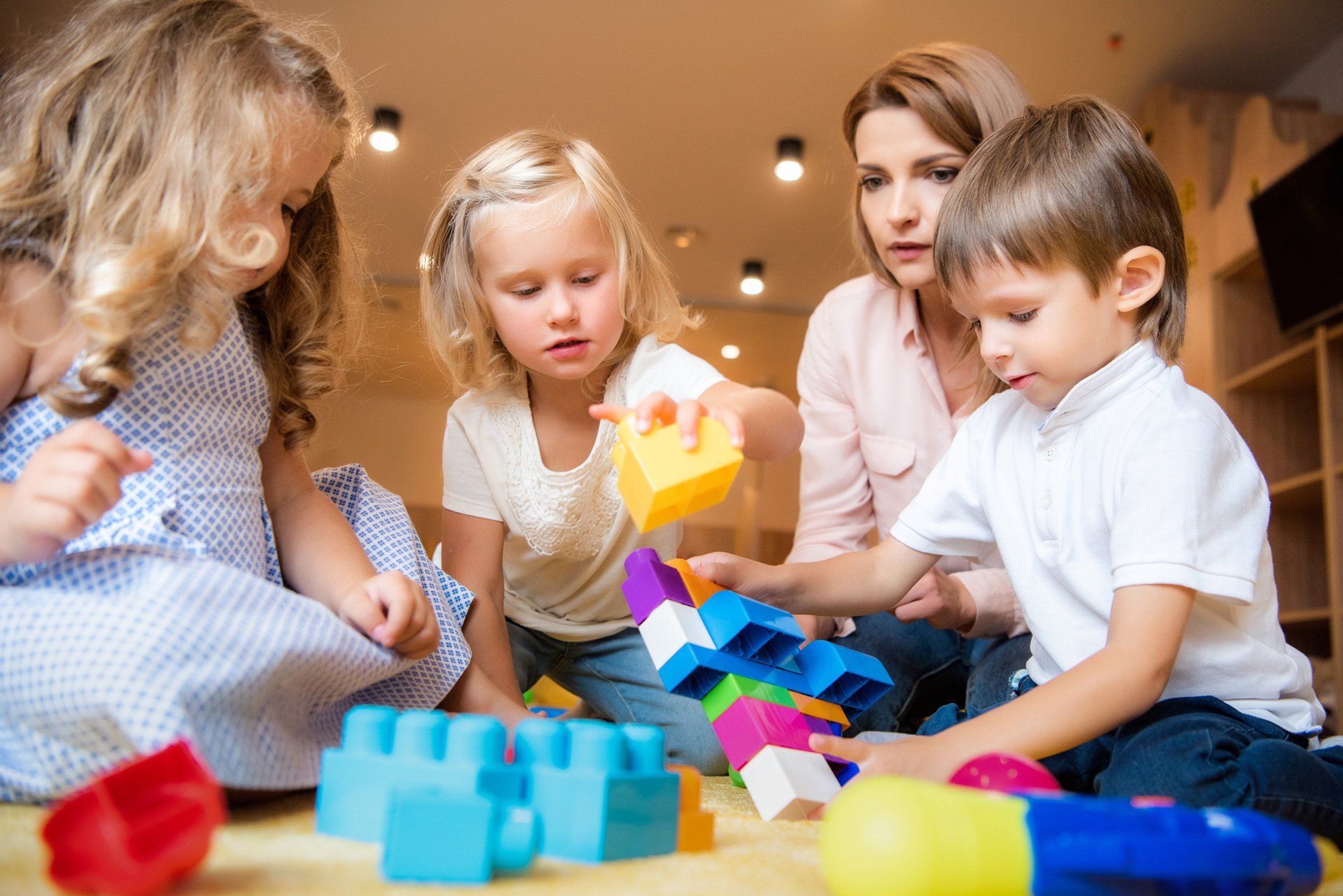 Three kids are playing building blocks | Walkley Heights, SA | Walkley Heights