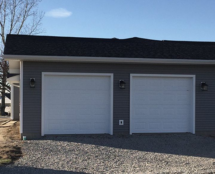 Custom Garage — Garage with Gray Doors and Navy Blue Roof in Saxonburg, PA