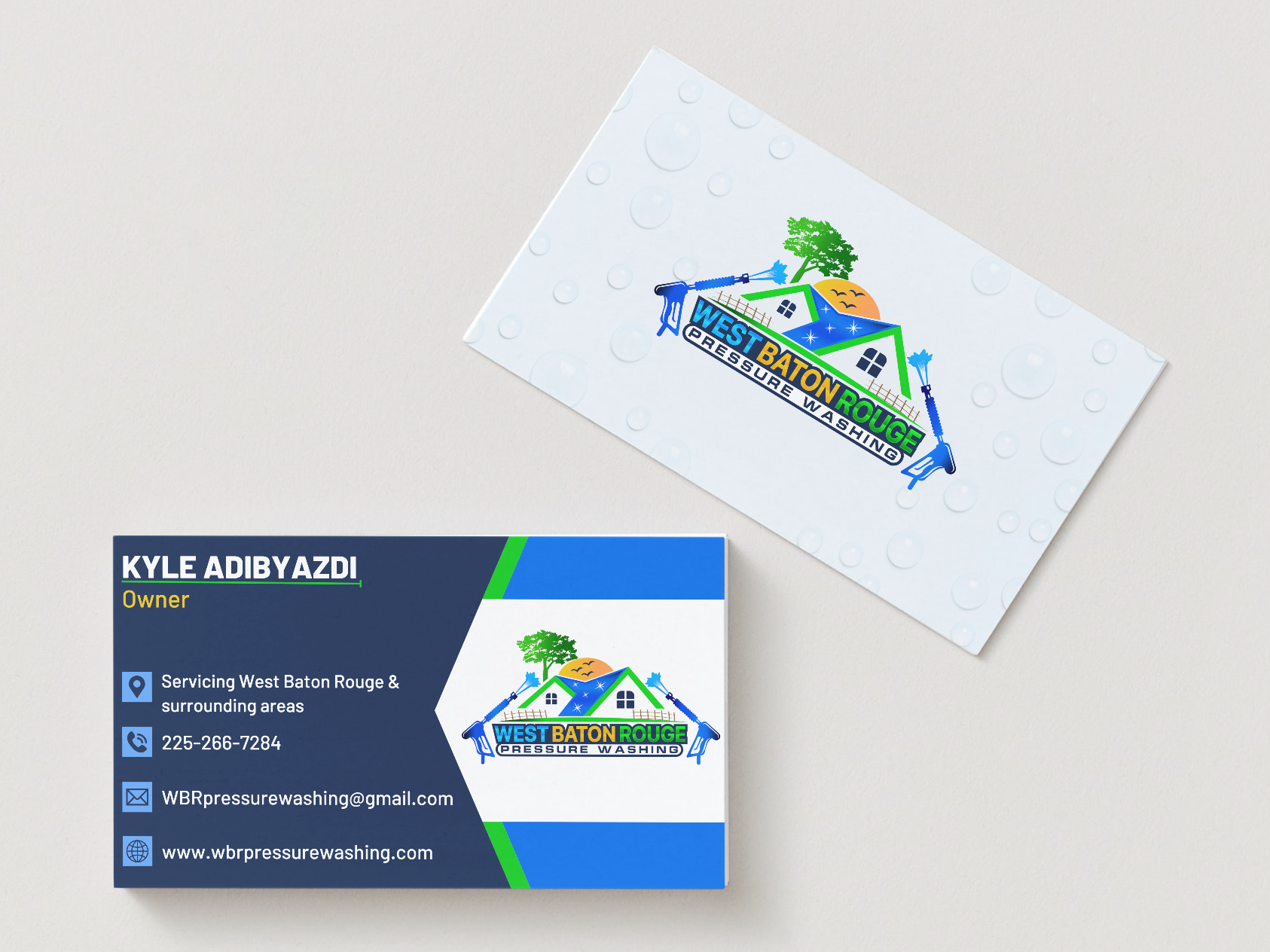 A business card with a house and a tree on it.