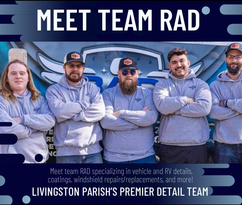 A group of men standing next to each other with their arms crossed.