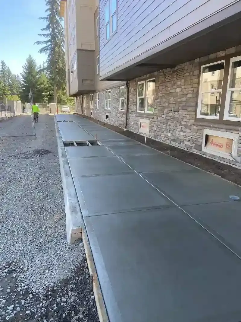 Even concrete sidewalk enhancing pedestrian pathways, professionally crafted by Nava Concrete LLC in Vancouver, Washington.
