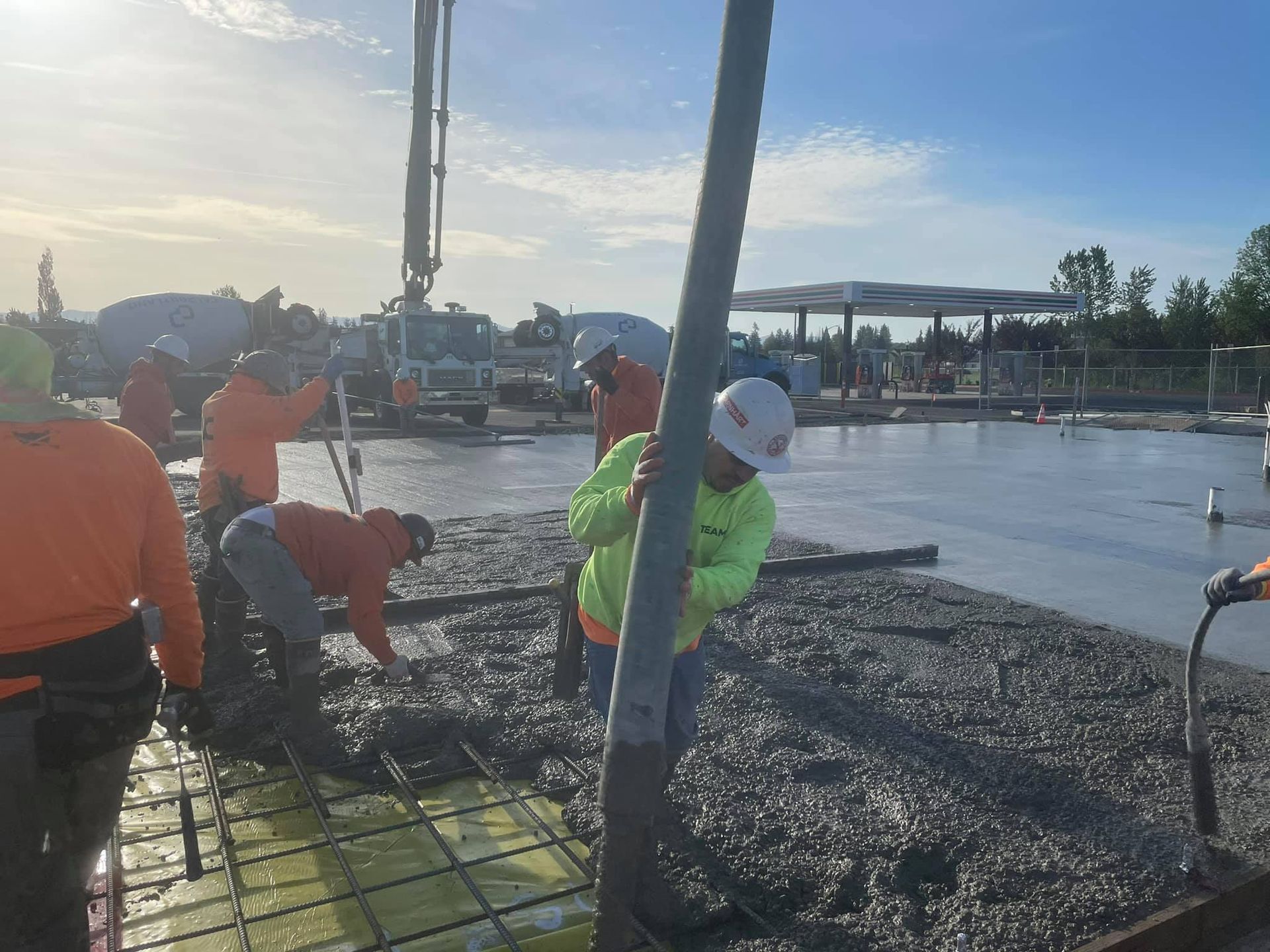 A group of construction workers are working on a concrete floor in Vancouver, WA