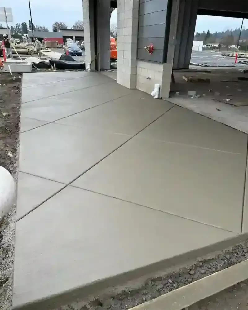 A concrete walkway is being built in front of a building in Vancouver Washington.