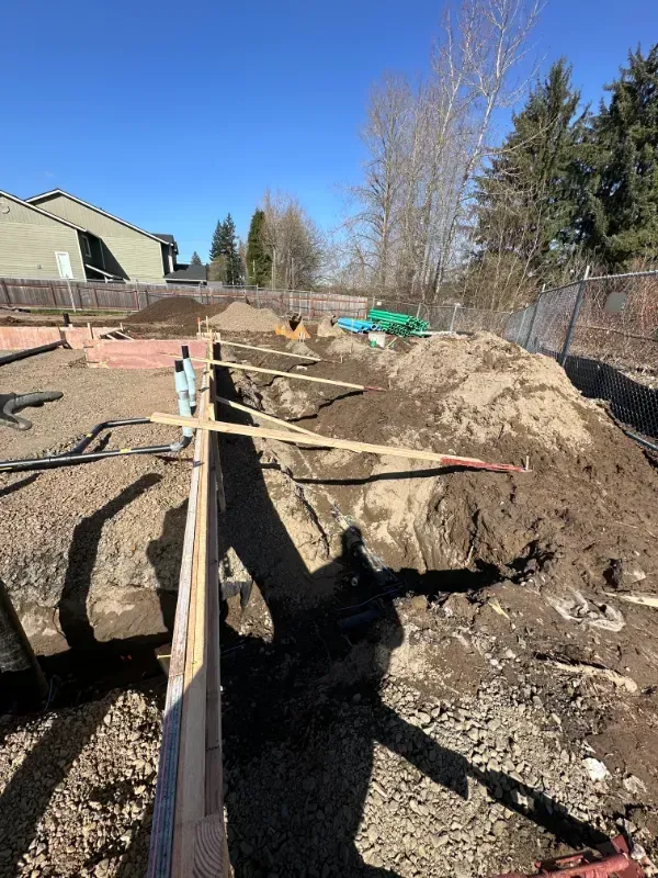 A concrete walkway is being built in front of a building under
construction in Vancouver, WA