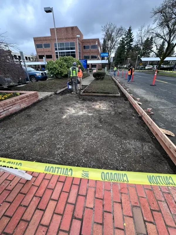 A concrete walkway is being built in front of a building in Vancouver, WA