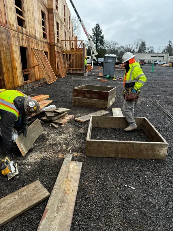 A group of construction workers are working on a construction site in Vancouver, WA