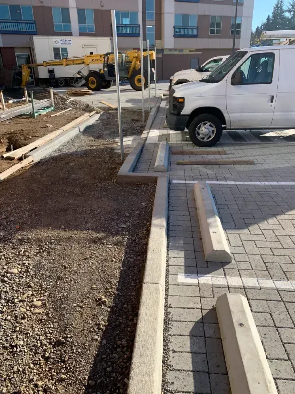 A white van is parked in a parking lot in Vancouver, WA by NAVA Concrete LLC.