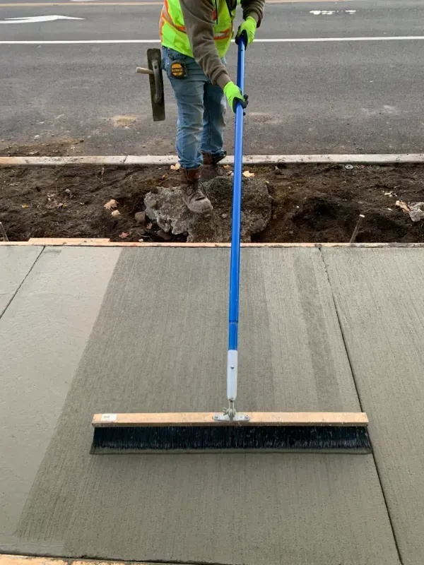 A sidewalk is being built in front of a building in Vancouver, WA