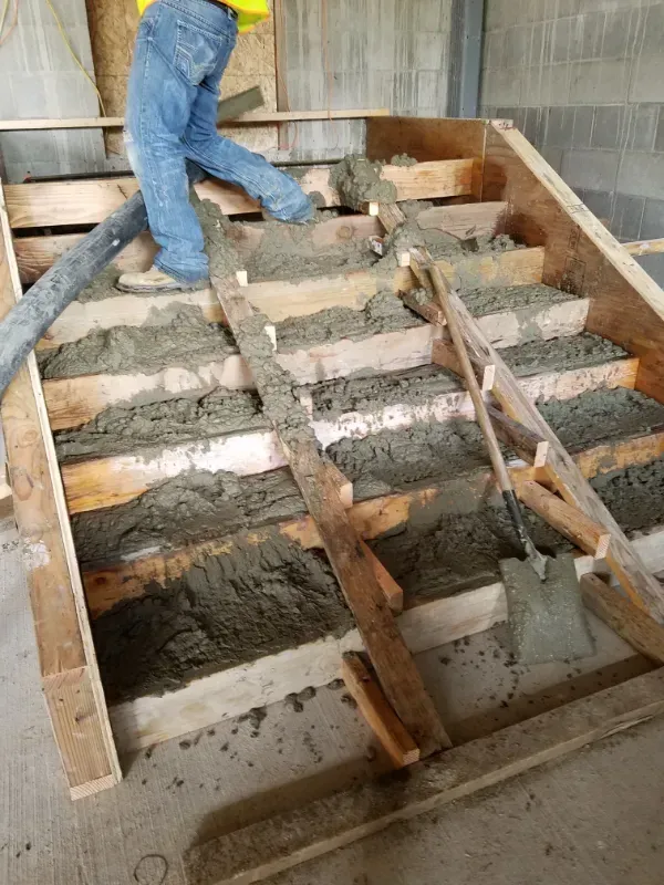 A concrete walkway is being built in front of a building under
construction in Vancouver, WA