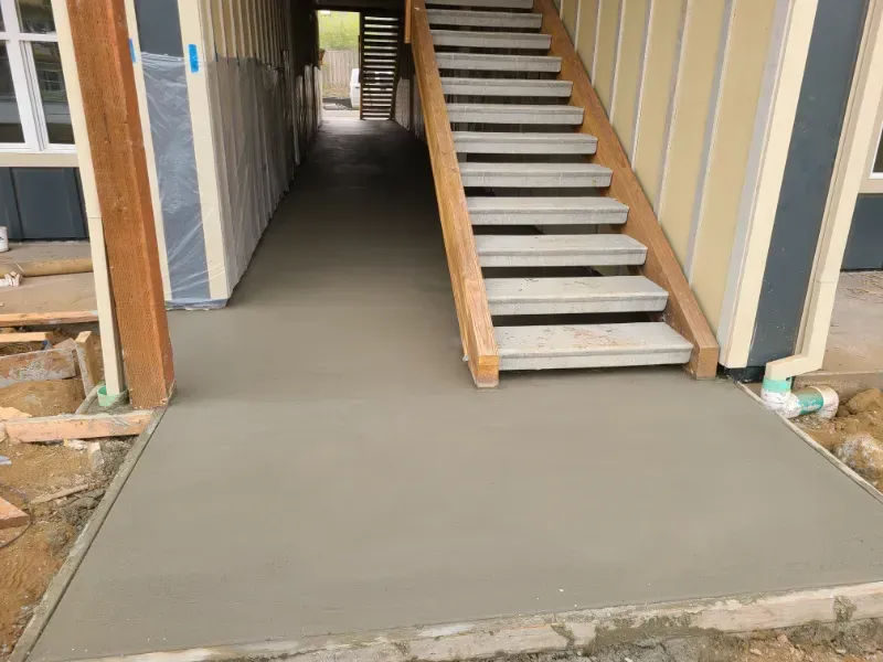 A concrete walkway is being built in front of a building under
construction in Vancouver, WA