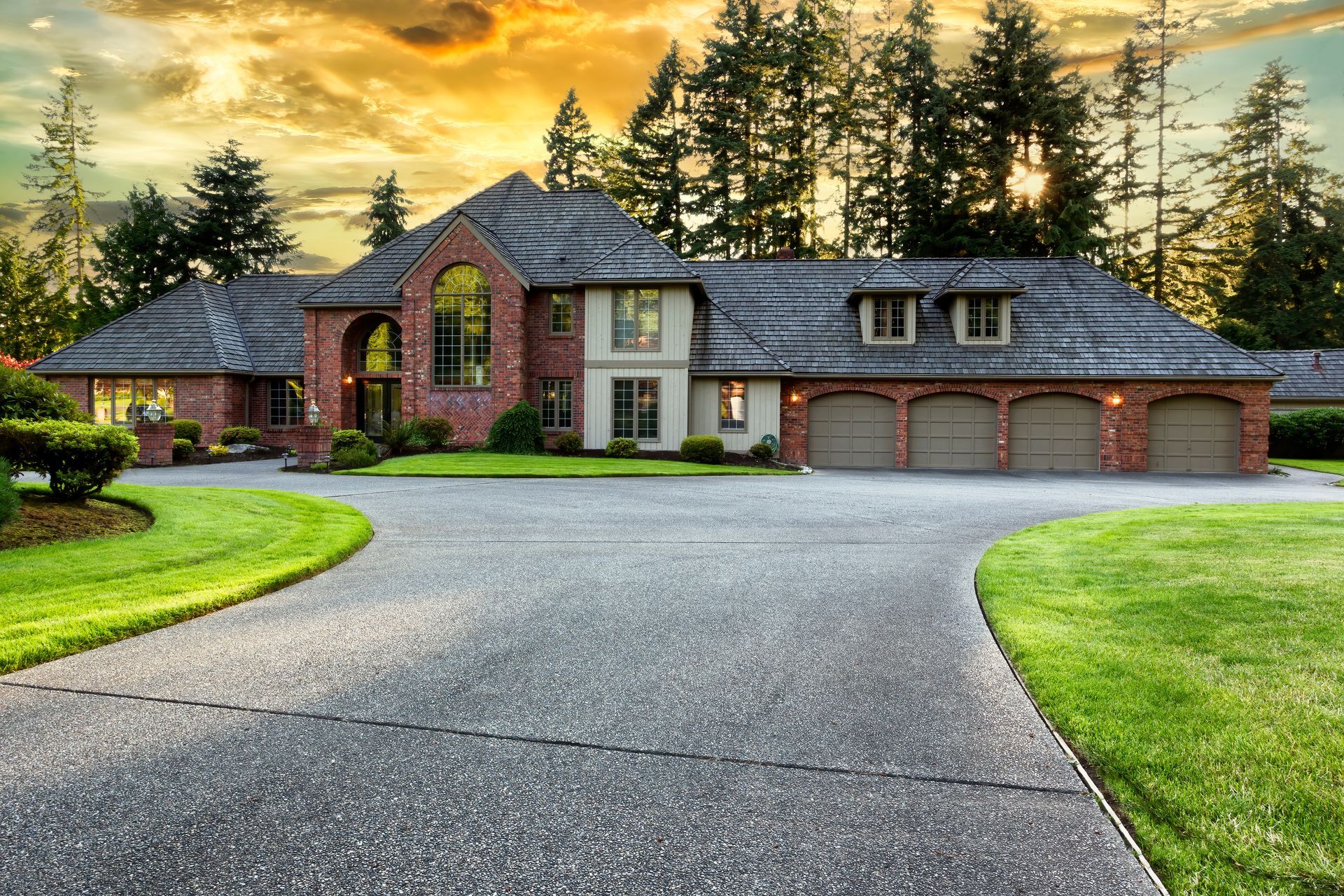 A large house with a driveway leading to it in Vancouver Washington by Nava Concrete LLC.