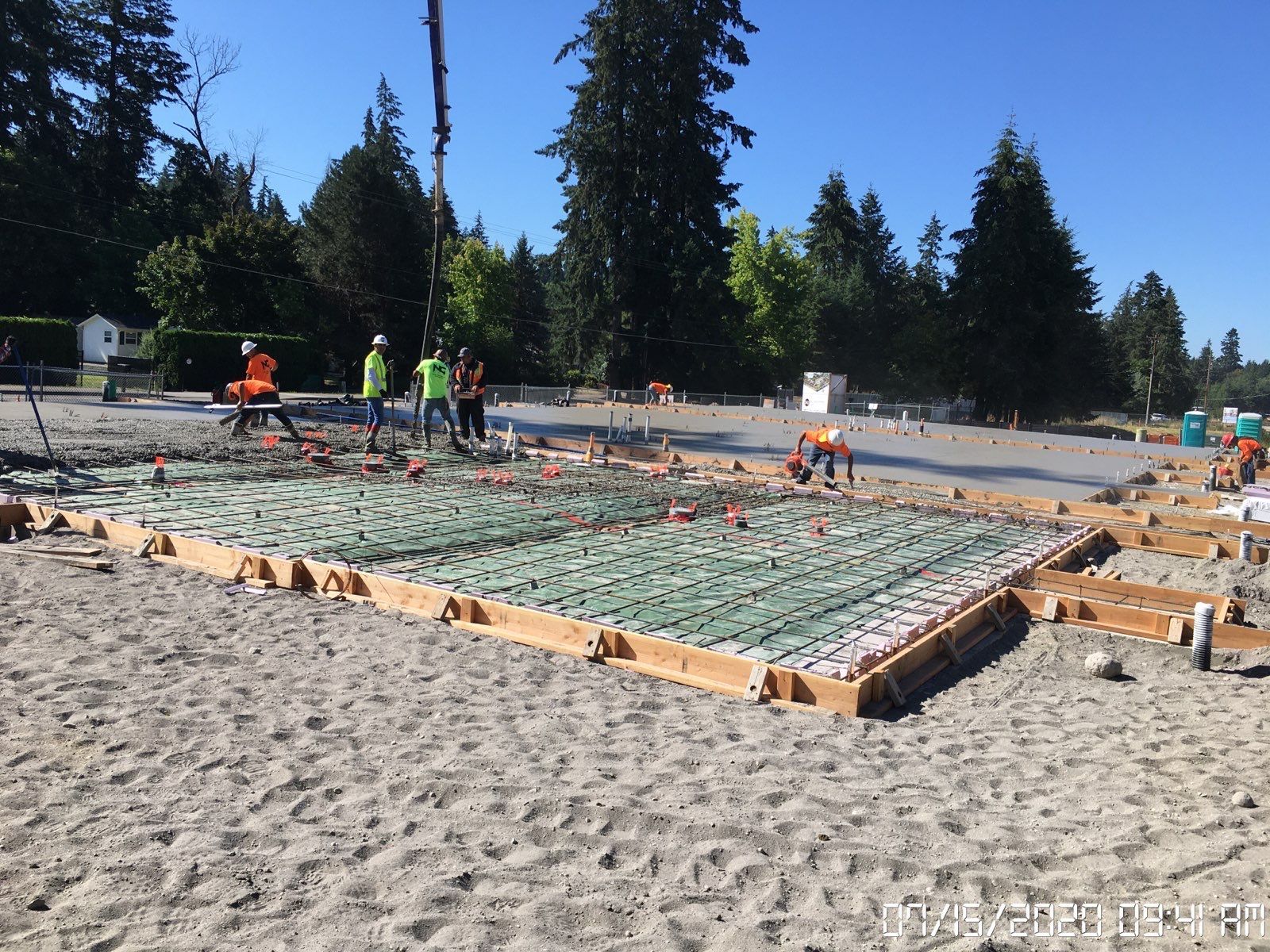 A concrete walkway is being built in front of a building under
construction in Vancouver, WA