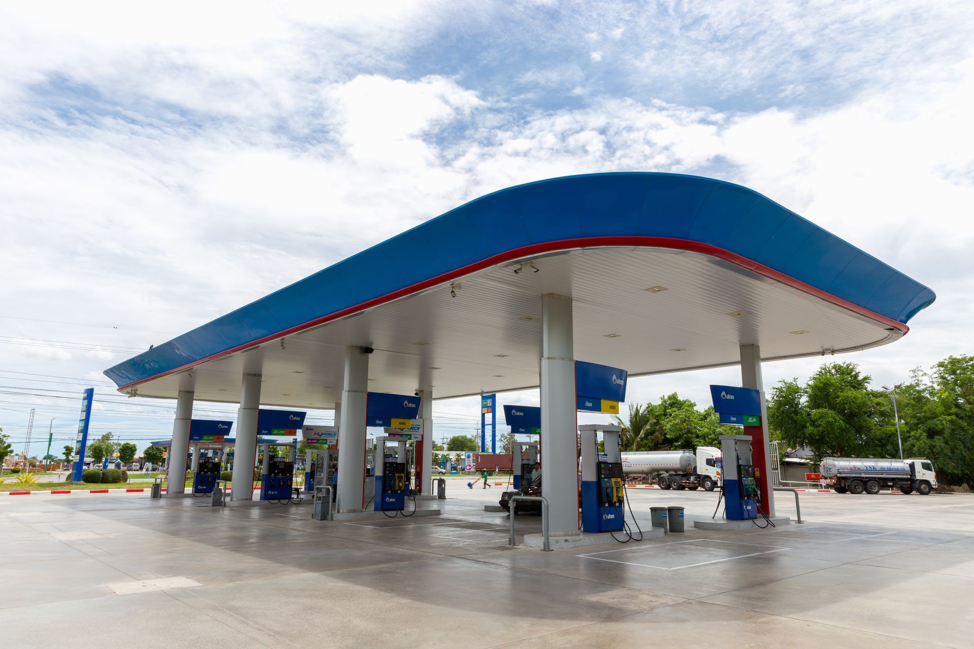 A blue and white gas station with a truck parked in front of it in Vancouver Washington by Nava Concrete LLC.
