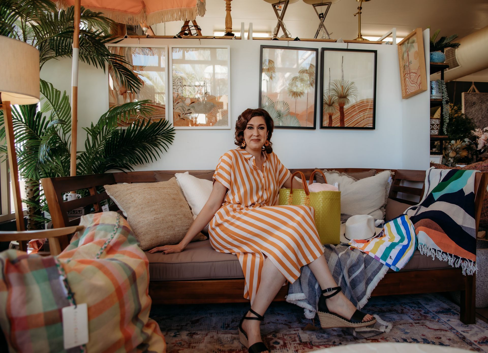 Woman is Sitting On Couch — Lavie Hair & Beauty in Ciccone, NT
