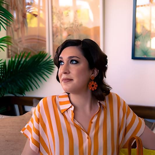 Woman Wearing a Striped Shirt and Earrings — Lavie Hair & Beauty in Ciccone, NT
