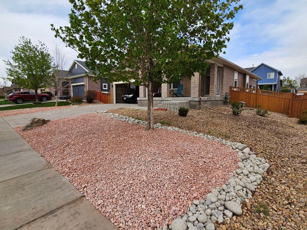 A house with a lot of rocks in front of it